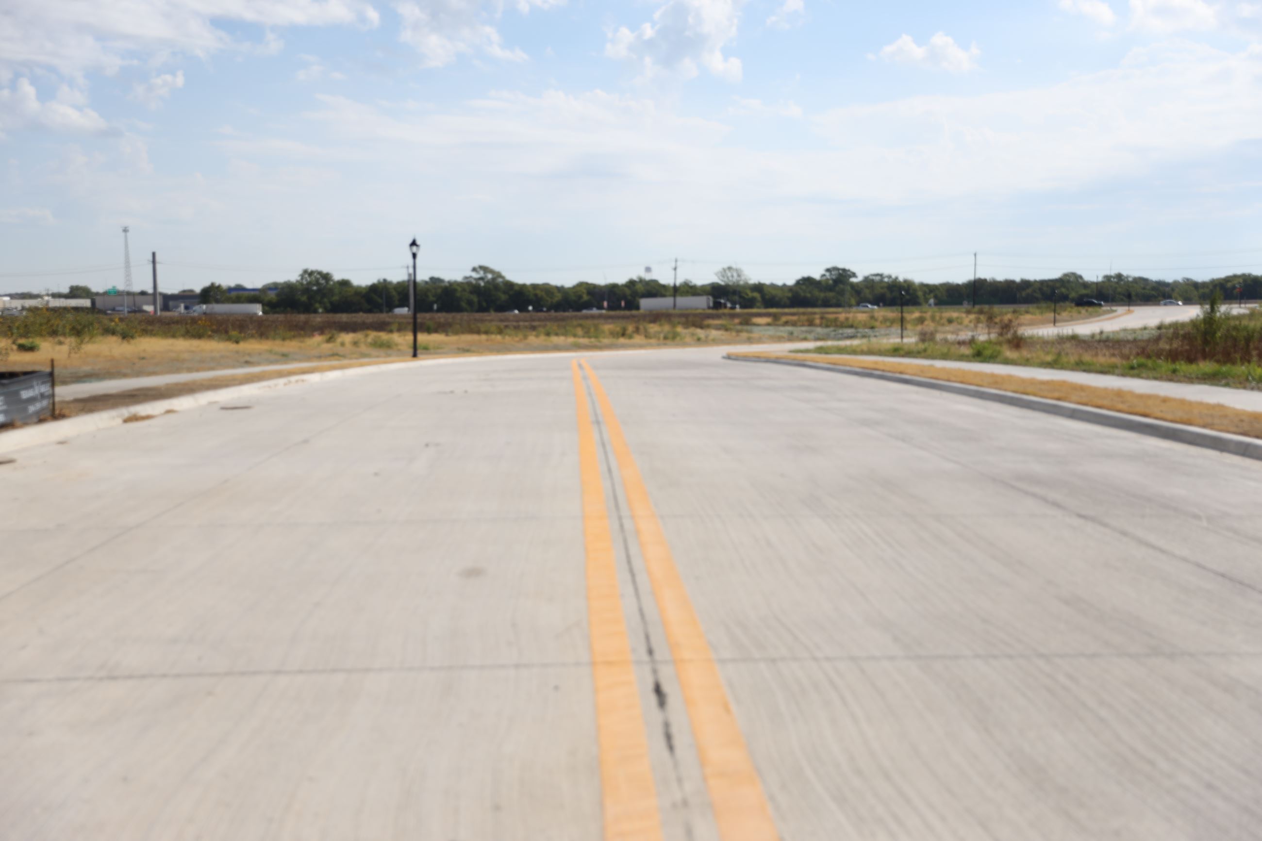 Stockport Drive Road improvement, newly paved roadway near US 75